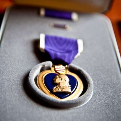 The Purple Heart medal in a case