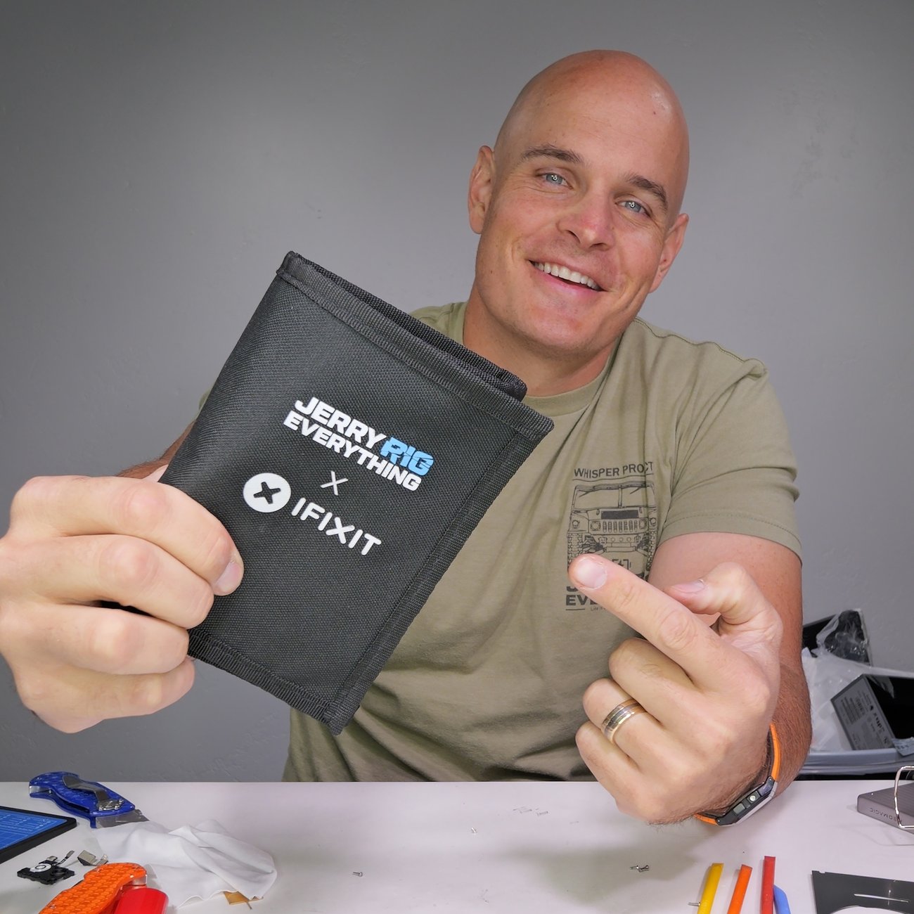 Zack Nelson of JerryRigEverything posing with his exclusive iFixit toolkit