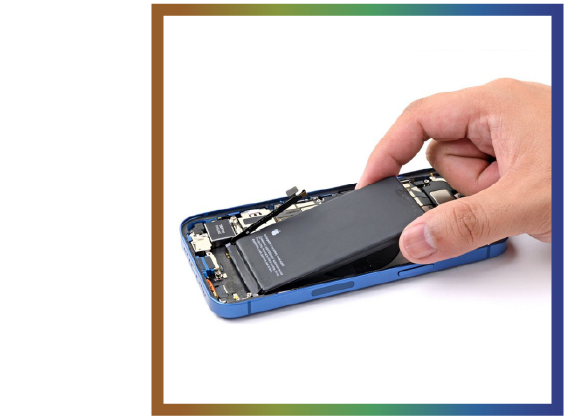 Hand removing the battery from an opened blue iPhone.