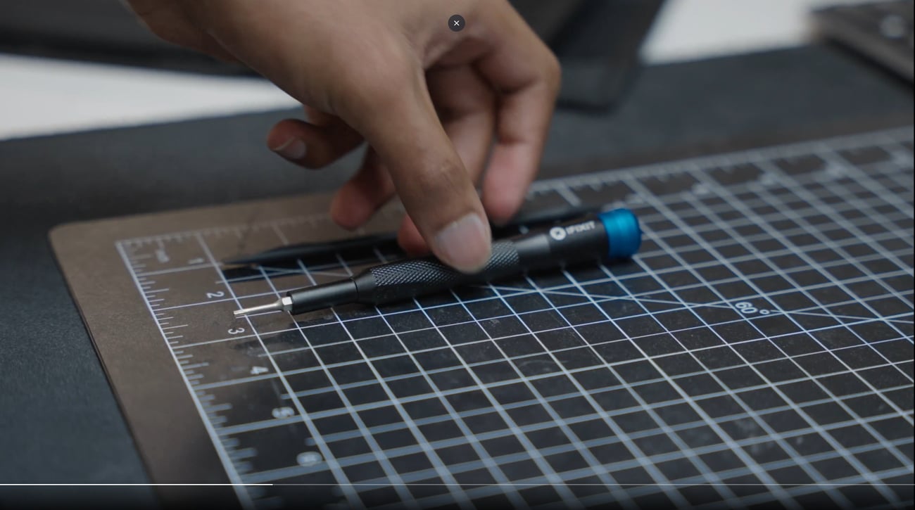 Our 4mm aluminum driver on a cutting mat in Tesla's office </div><script type=