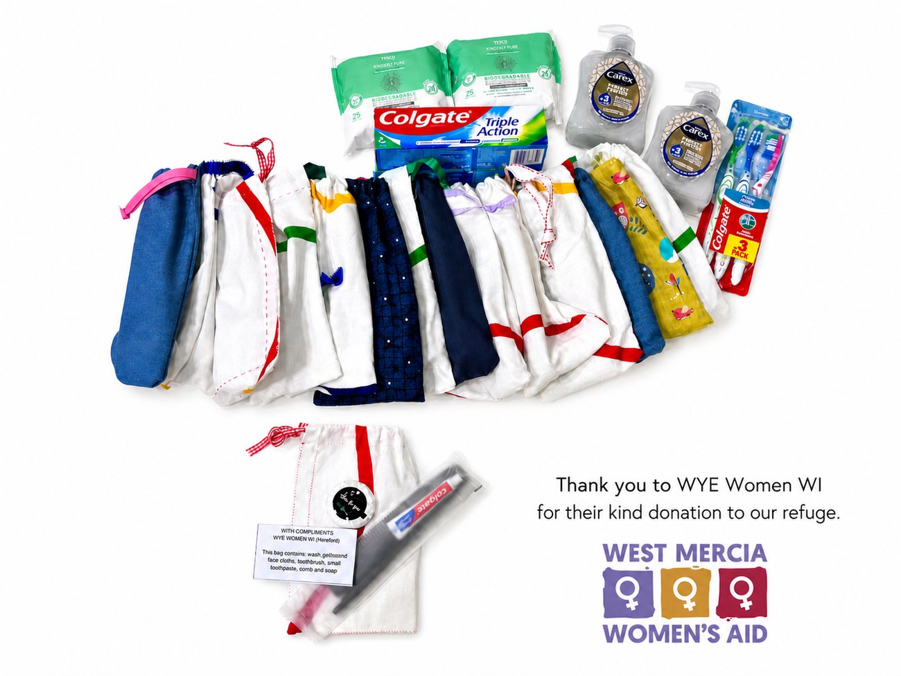 Handmade toiletry bags and donated hygiene items arranged for women and children arriving at refuge accommodation, alongside a West Mercia Women’s Aid thank-you message.