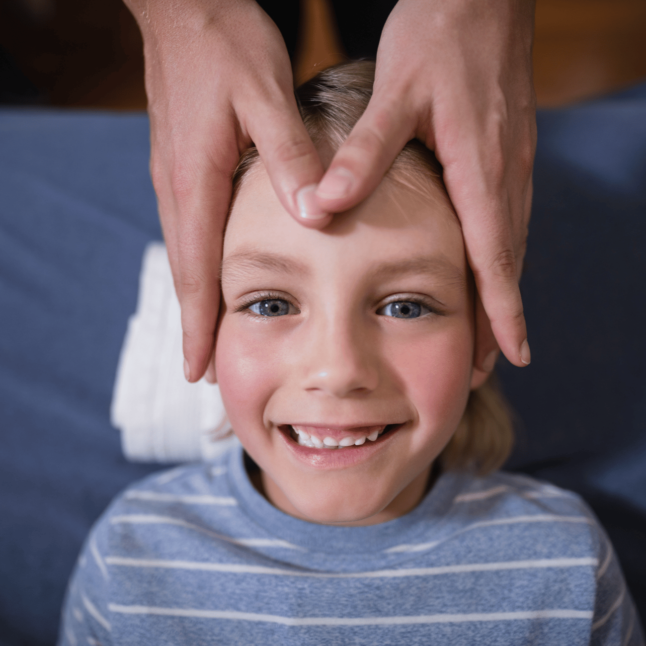 Child having his head massaged. 