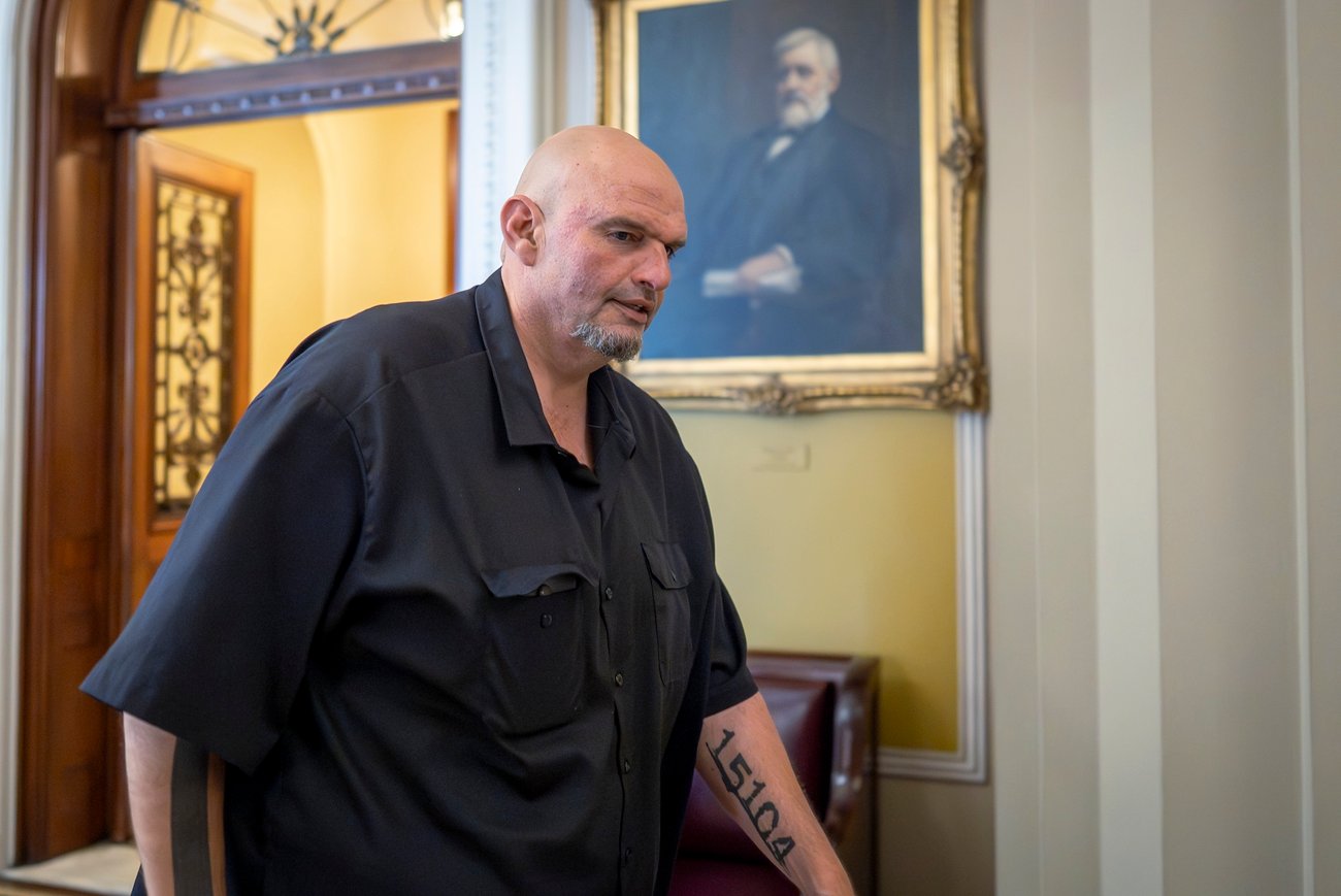 Sen. John Fetterman (D., Pa.) leaves the chamber as the Senate holds a procedural vote on July 24, 2025.