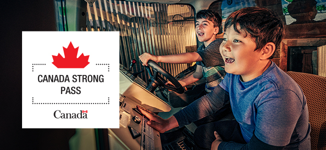 Two smiling children play in a hands-on tractor exhibit. Beside them is a graphic with a red maple leaf that reads “Canada Strong Pass” and features the Government of Canada logo.