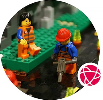 A close-up scene of two LEGO figures on a play table.