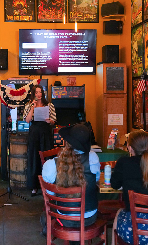 photo of presenter at Wops Hops, crowd listening