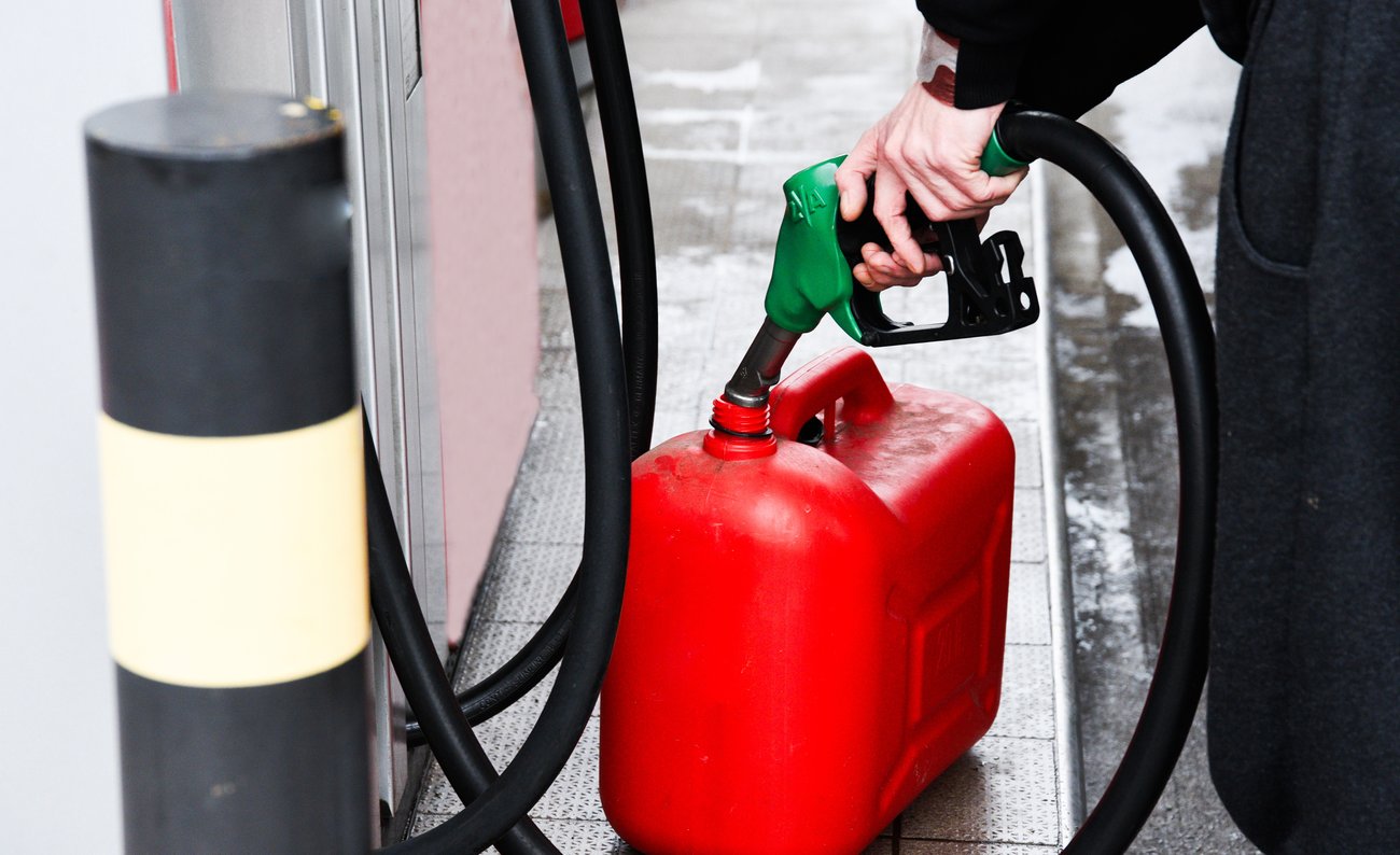 Person filling gas tank