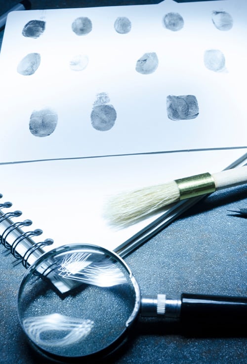 finger prints and a magnifying glass