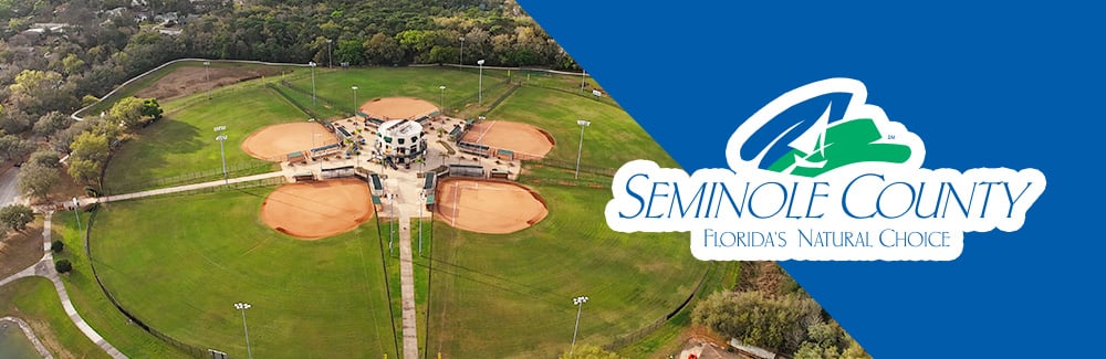 Seminole County Logo with a photo softball complex
