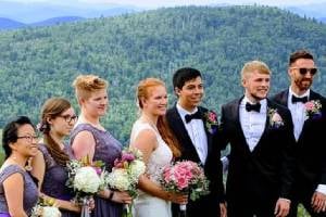 wedding party with mountain behind them wedding party with mountain behind them