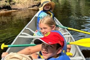 three kids in a canoe three kids in a canoe