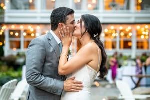 bride and groom kiss