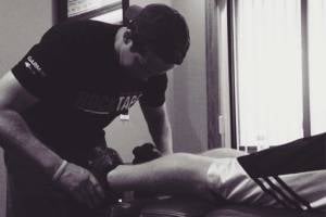 doctor working on patient's leg