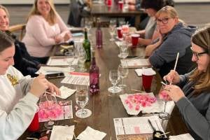 group painting wine glasses