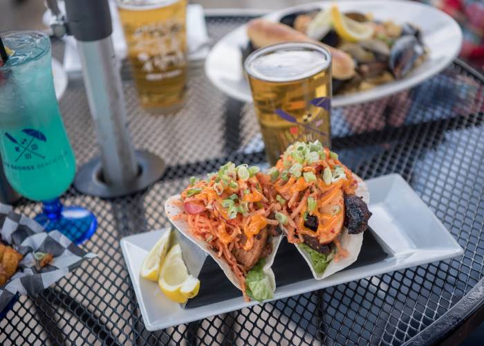 patio dining with lake george backdrop
