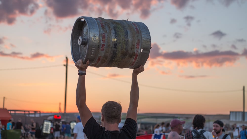 lifting-beer-keg-sunset