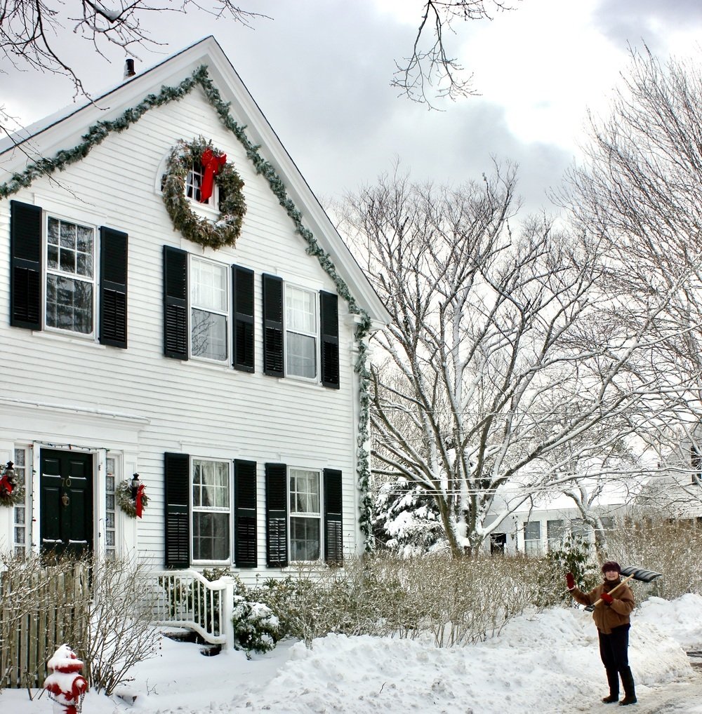 Susan Branch in front of her house