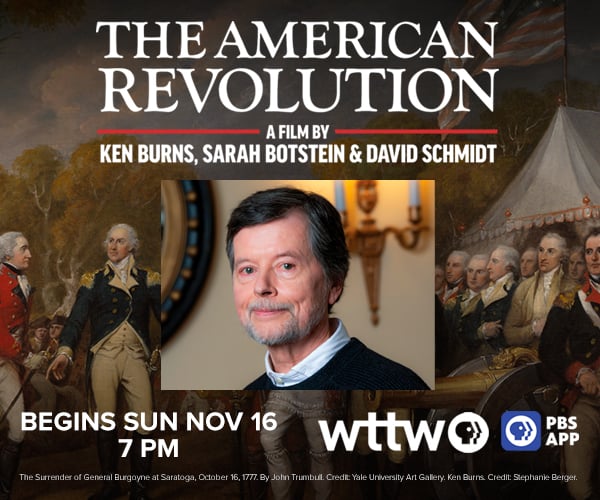 Ad: TThe American Revolution A Film by Ken Burns, Sarah Botstein & David Schmidt begins Sun Nov 16 at 7 pm on WTTW and PBS App. Pictured: Ken Burns standing in front of American Revolutionary War paintings.