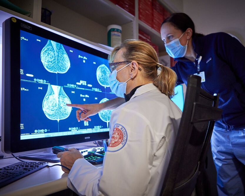 Radiology clinicians reviewing imaging results 