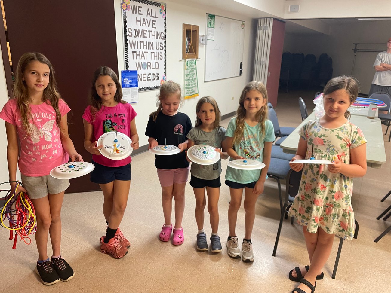 Six 4-H club members, girls aged 6-11 display 4-H project crafts.