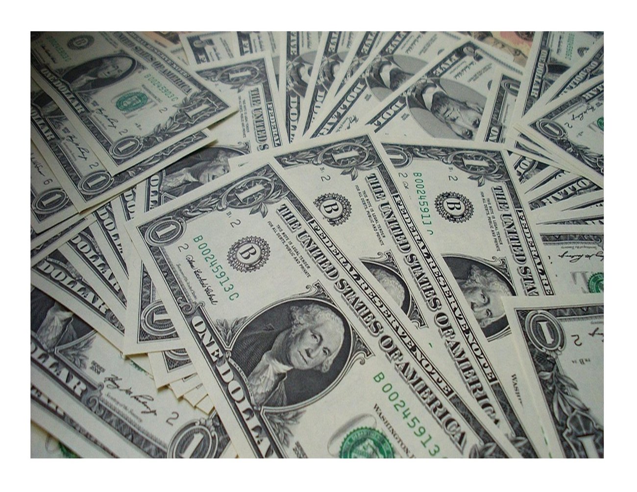 scattered pile of one dollar bills scattered pile of one dollar bills