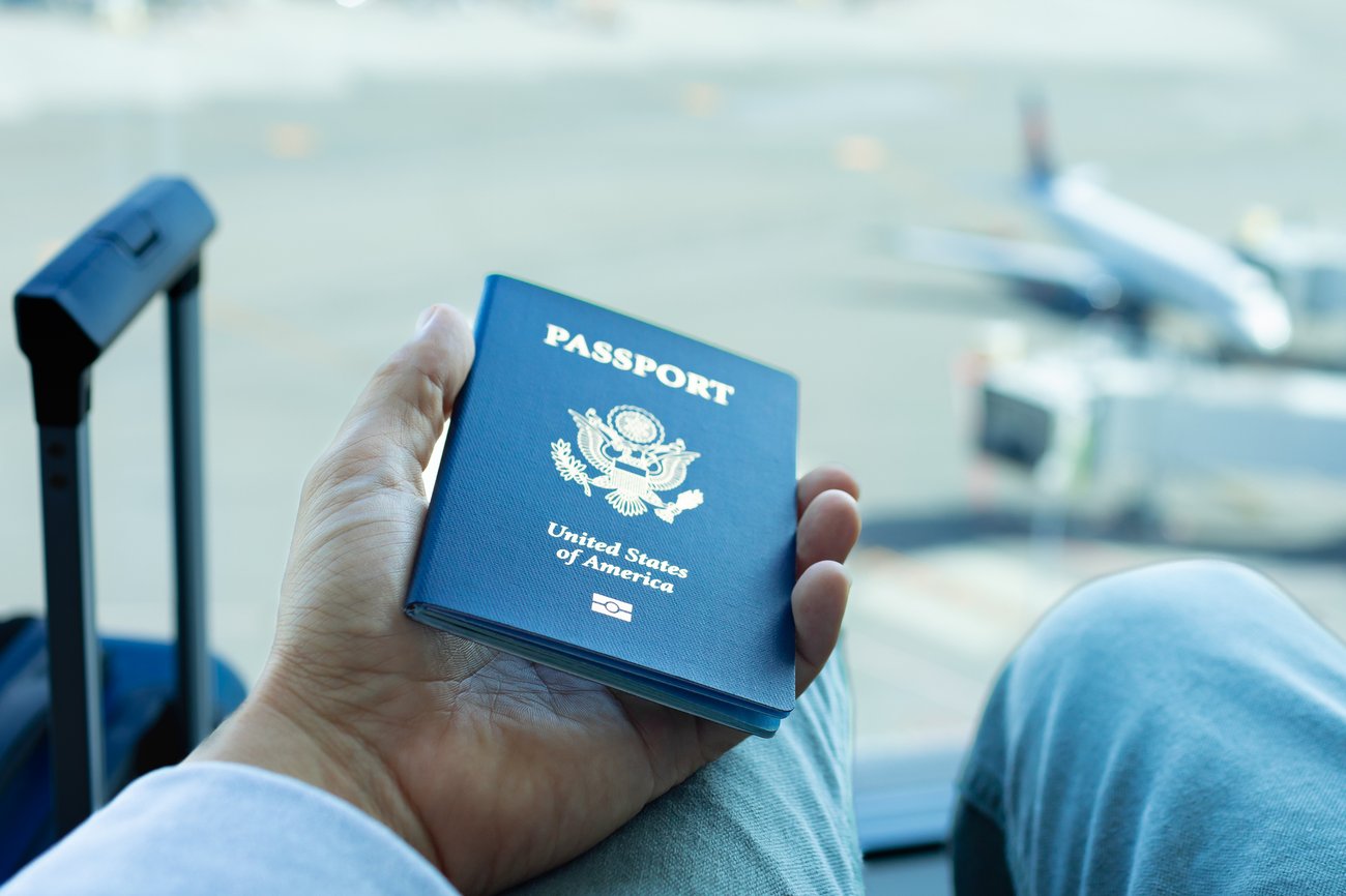 Man holding US passport in his hand and waiting for the immigration