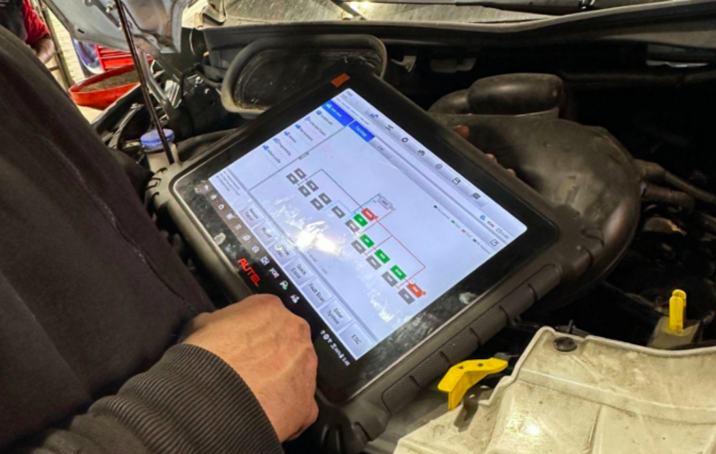 A mechanic accesses a car's telematic data