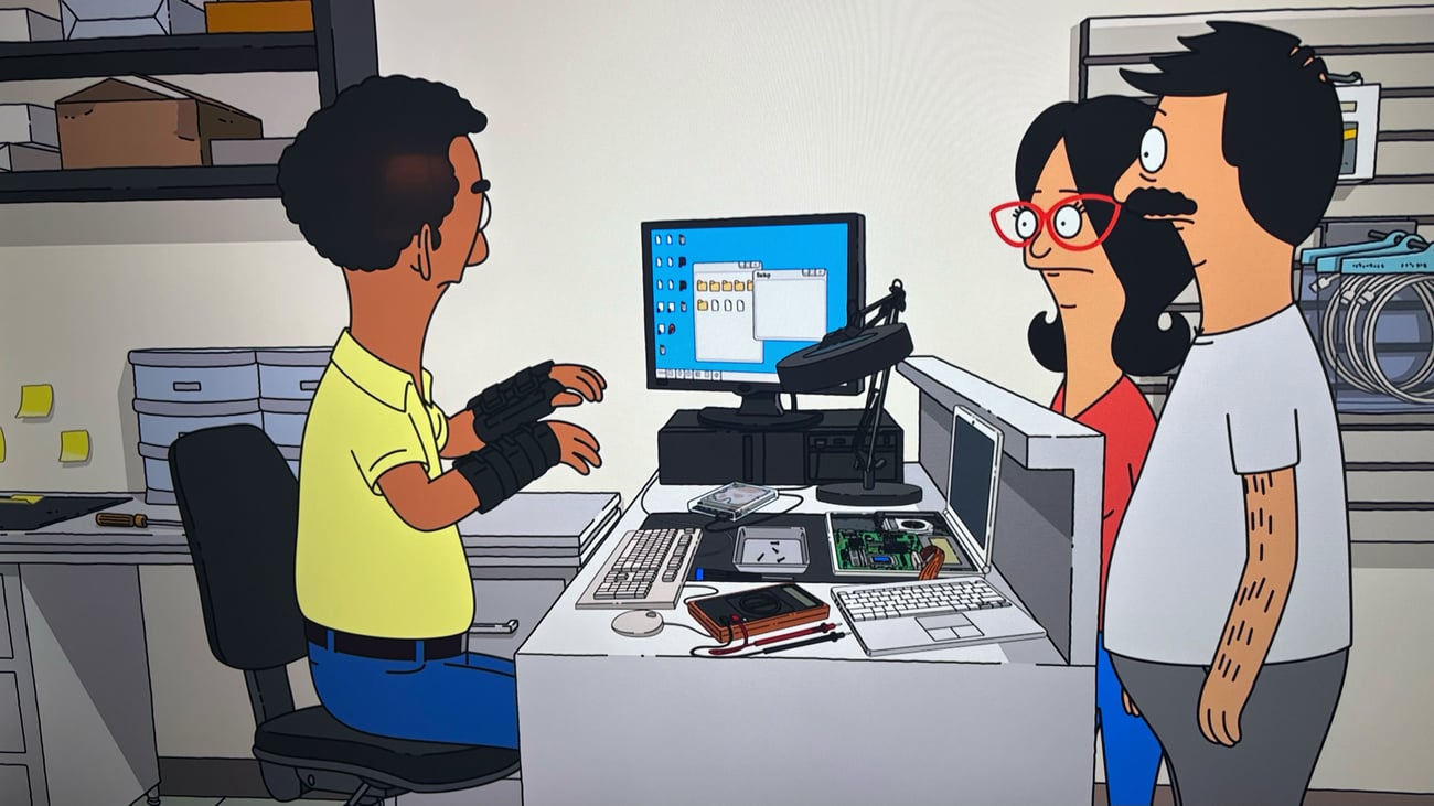 A screenshot from Bob's Burgers depicting Bob and Linda at a tech repair shop.