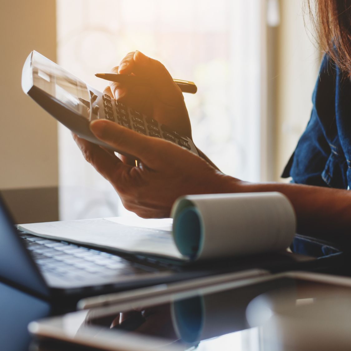 Woman using calculator 