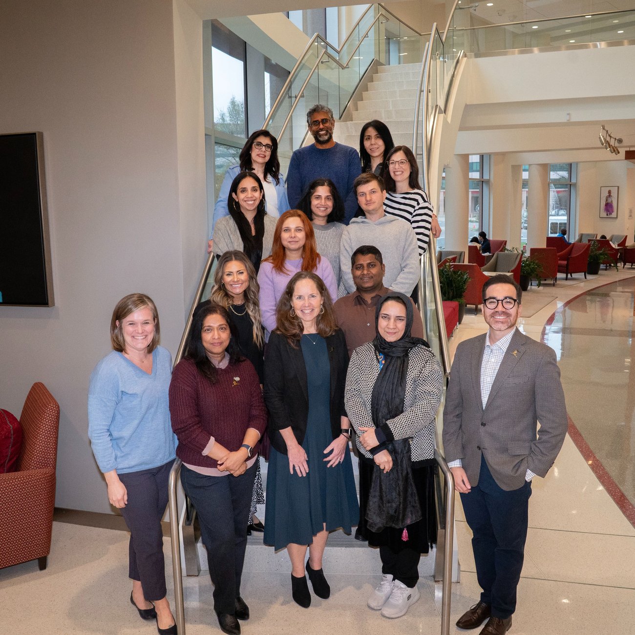 Image of the TAB members standing on stairs 