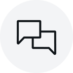 Light grey circular icon showing two overlapping black speech bubbles, centered on a solid background.