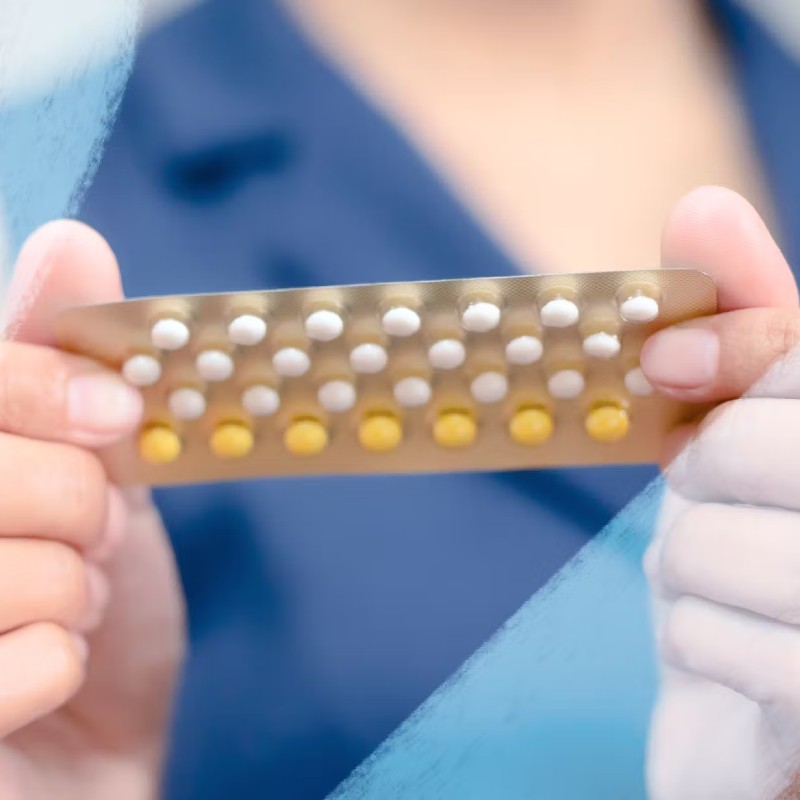 Image of someone holding a birth control pill packet