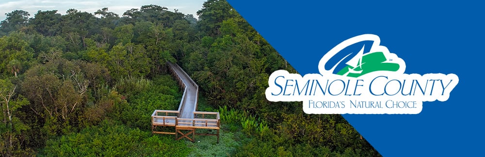 Seminole County Logo with a photo of spring hammock preserve dock