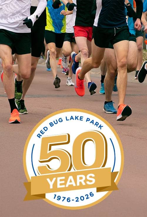 50th anniversary logo underneath a group of running legs