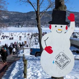 lake george winter carnival snowman sign