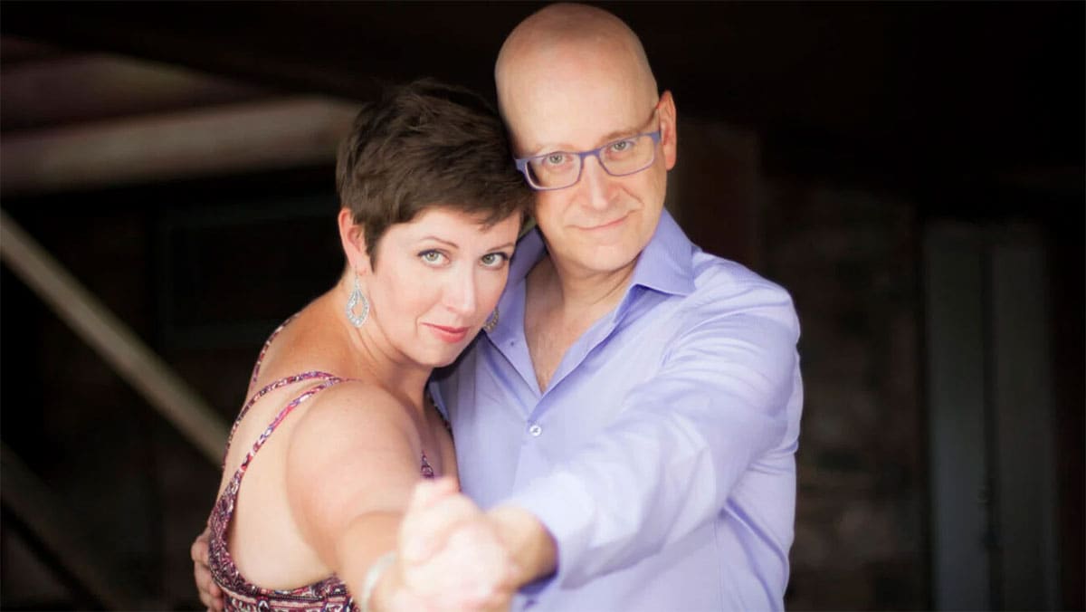 Dancing man and woman look into camera Dancing man and woman look into camera