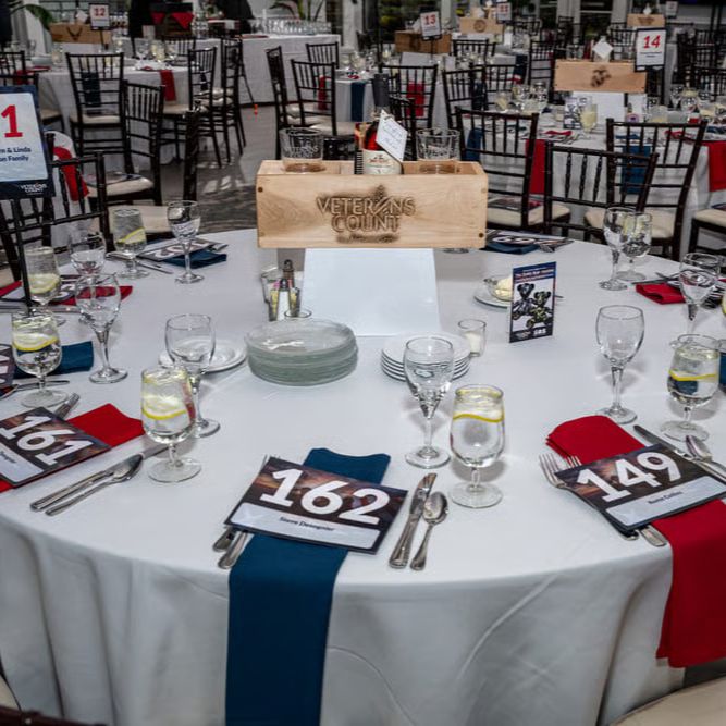 A group of runners stand at the start line at the Veterans Count Nashua 5k.