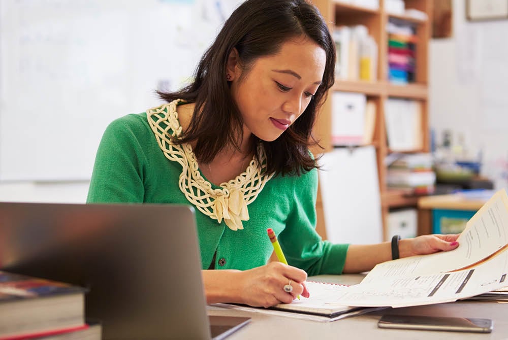 Woman Writing at Desk