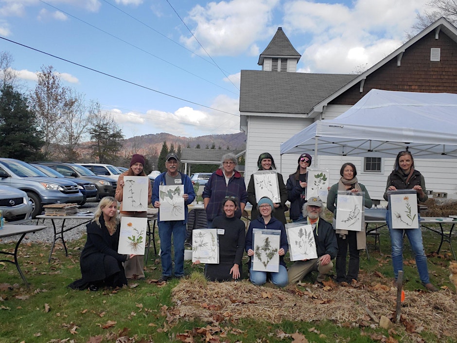 Particpants display their handiwork after a plant voucher workshop