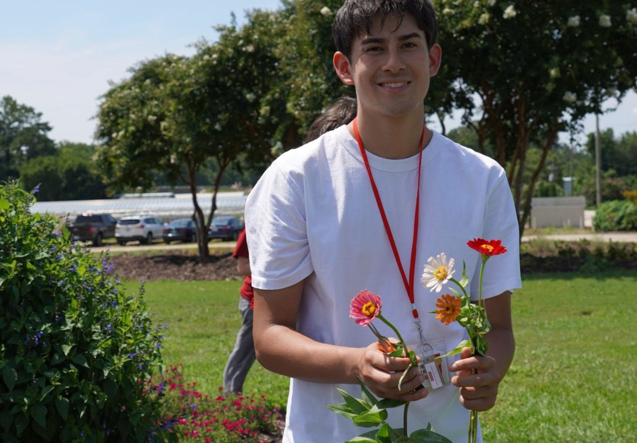 Youth holding flowers