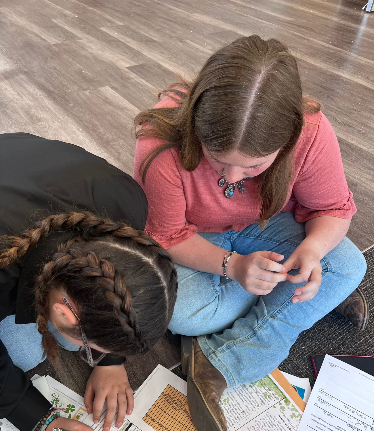 Stanly 4-H teens seated filling out a district officer election ballot
