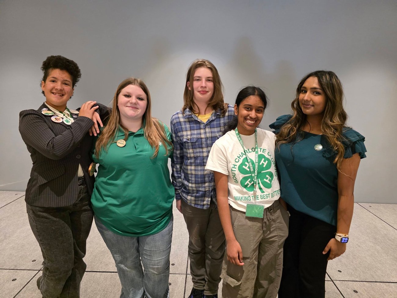 4 teen 4-H'ers posed together 