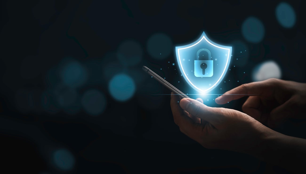 man holding phone with a lock overlay above it, security concept