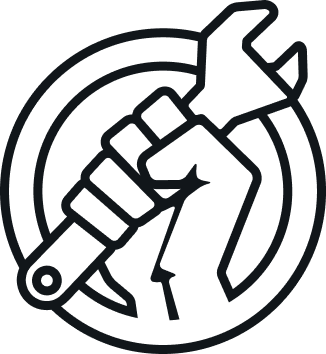 A group of people at a protest hold handmade cardboard signs, including one in the foreground reading 