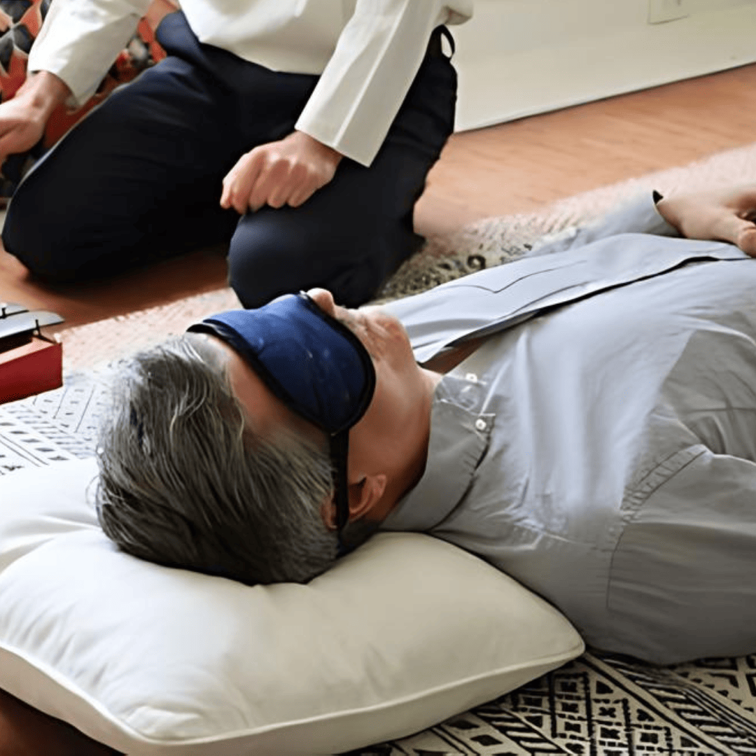 patient laying down with eye mask on during dosing session