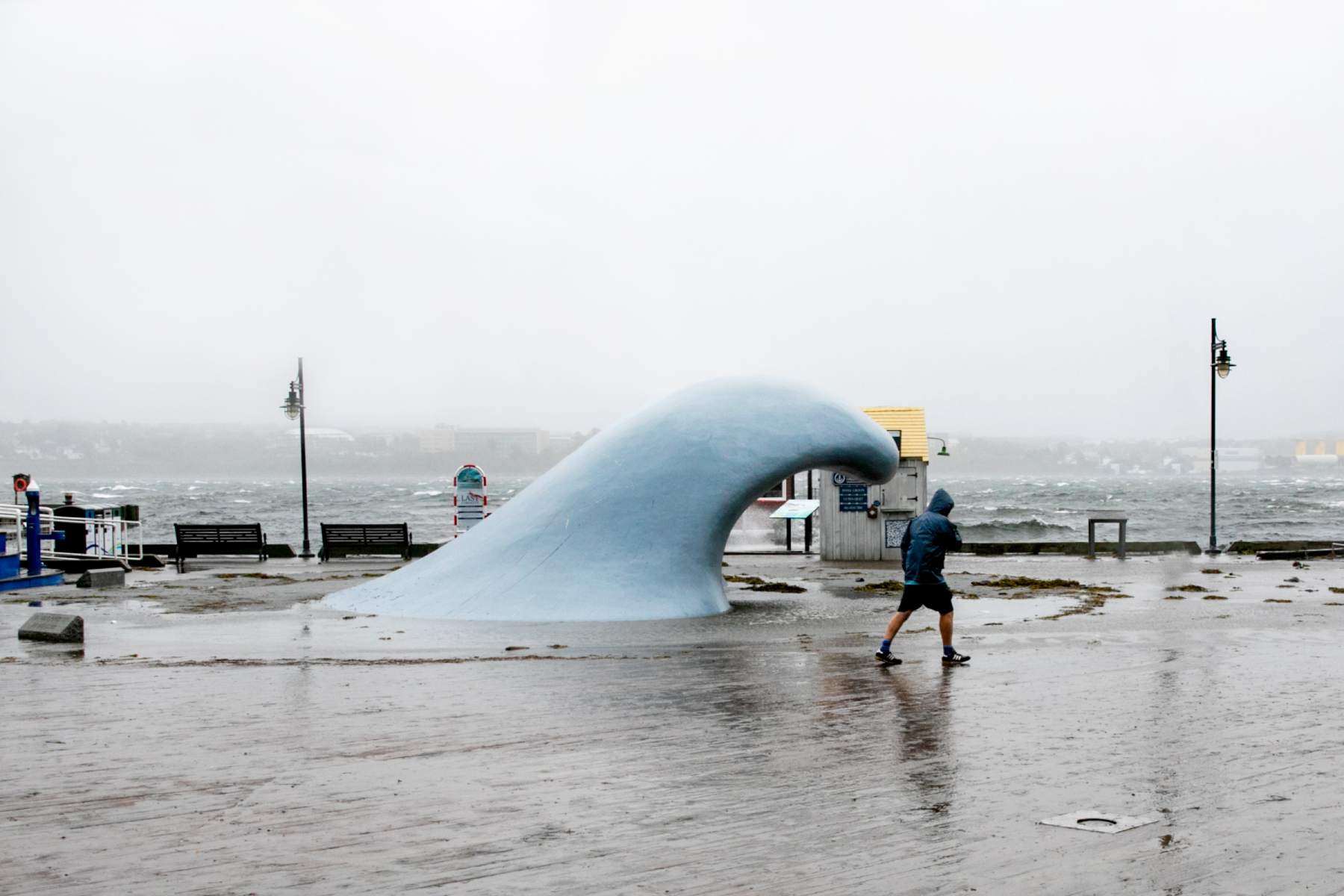 A man struggles to walk through strong winds in Halifax, during post-tropical storm Lee in September 2023.