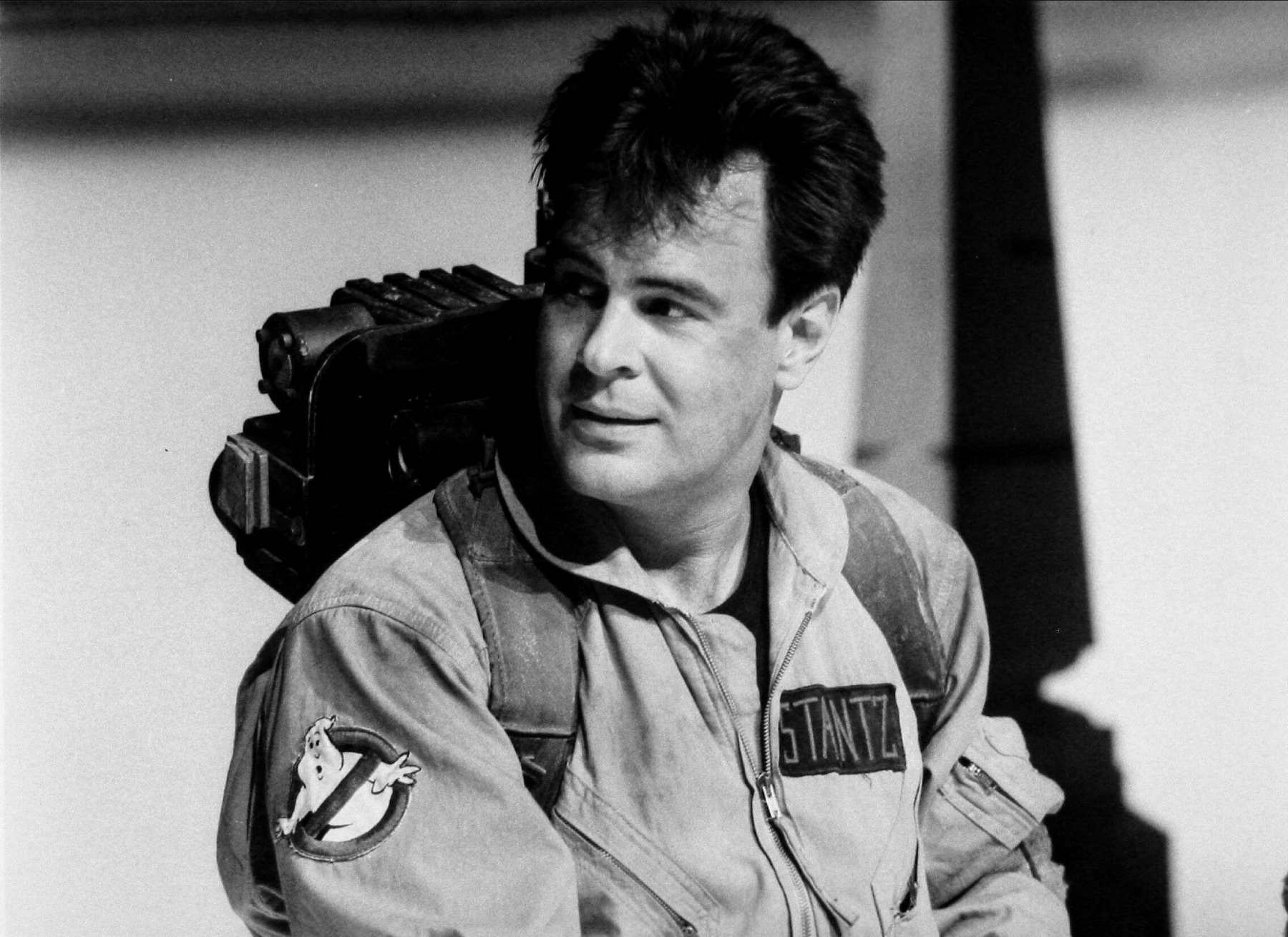 A black and white still showing Daniel Aykroyd from the movie Ghostbusters.