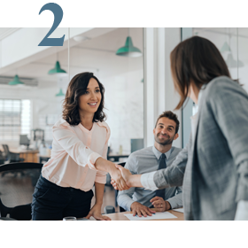 two business women shaking hands